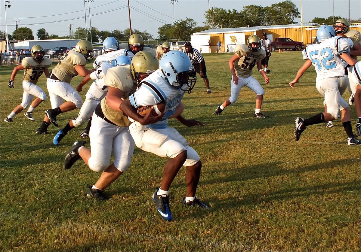 Image: Zain Byers latches onto a Cougar runner in the enemies backfield for a loss of yards on the play.