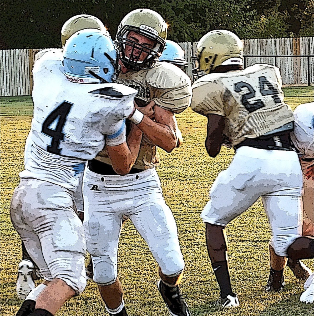 Image: Gladiator center, Brandon Souder, makes a running lane for teammate Ryheem Walker(24).