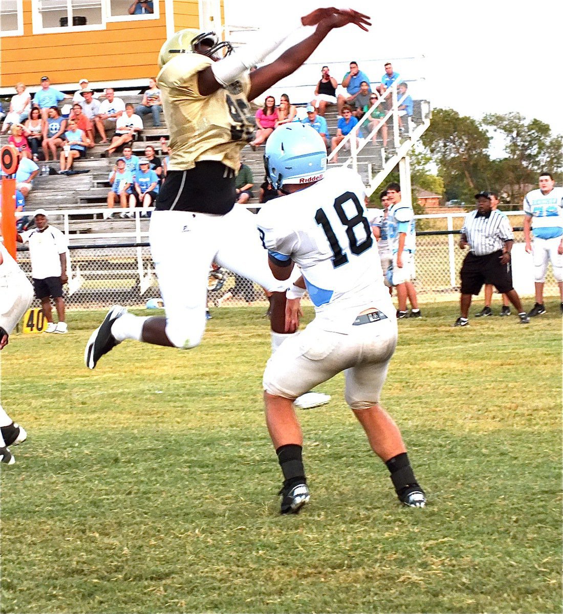 Image: Defensive tackle, Larry Mayberry, Jr.(99), pressures Waco Reicher’s quarterback into throwing an incomplete pass.