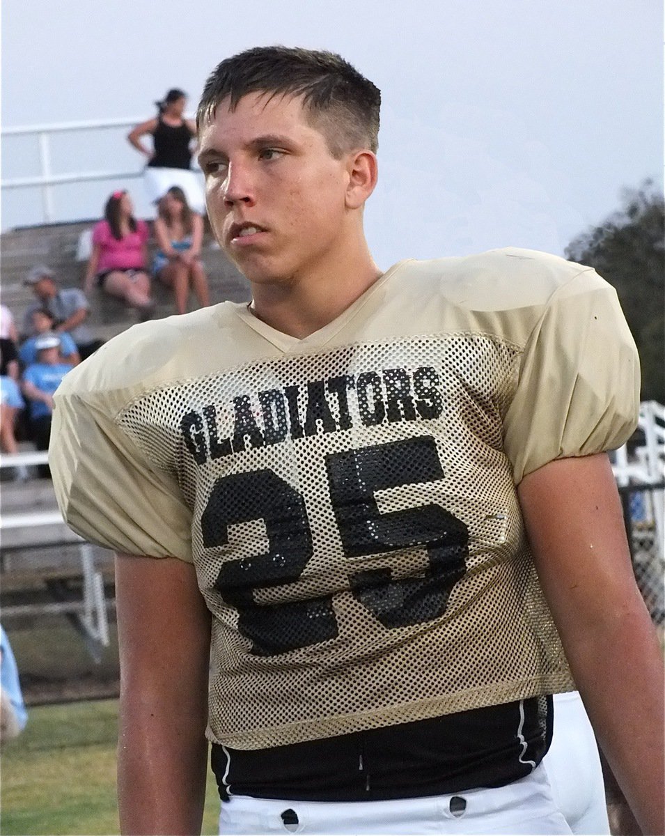 Image: Kyle Jackson(25) glares toward the Cougar huddle during a break in the action.