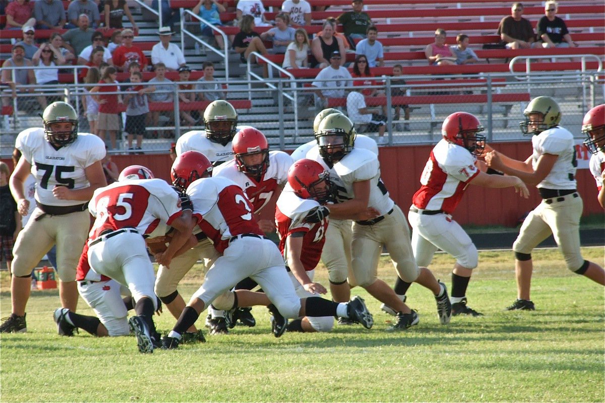 Image: Justin Wood(48) gets brought down by the lower digit numbers in Maypearl’s secondary which means Italy’s front line blockers got the job done against the higher digits.