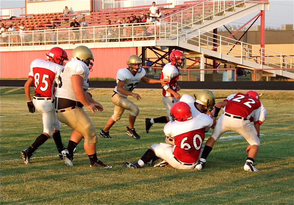 Image: Shad Newman(25) runs over a couple of Panther defenders as he crosses the goal line.