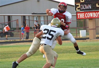 Image: Zain Byers(50) and Shad Newman(25) pressure Maypearl’s quarterback into throwing an incomplete pass.