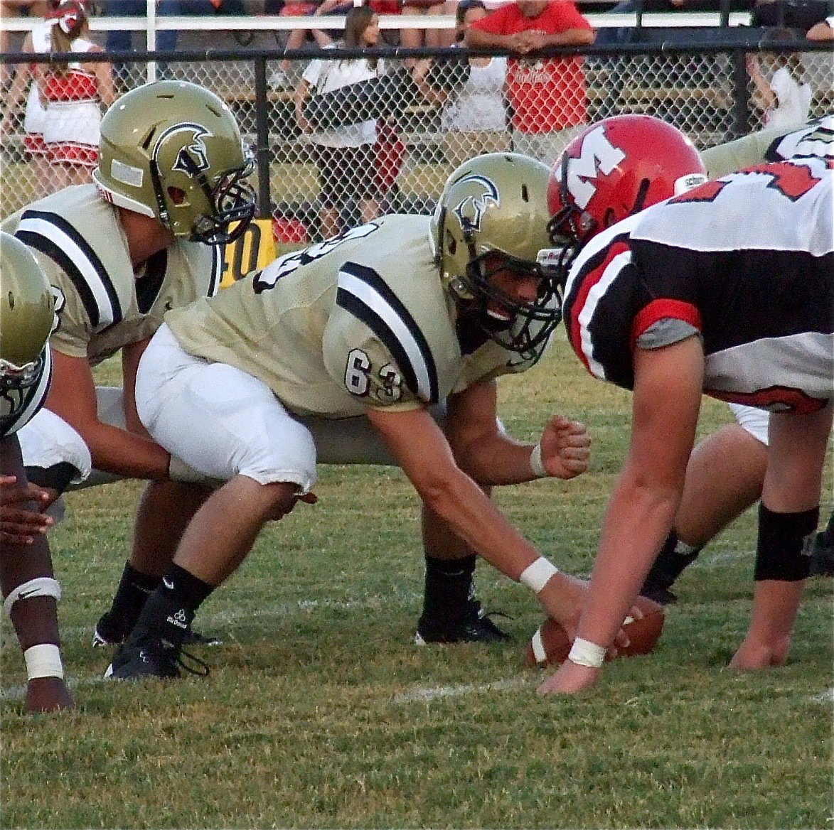 Image: Brandon Souder(63) gets set to snap the ball to quarterback Jase Holden(3) with Italy about to punch it in on the opening drive. Unfortunately, Souder, severely injured his left leg on the play and will be out for the remainder of his senior season.