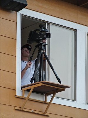 Image: Caden Jacinto films for the Gladiators from within the press box.