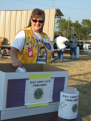 Image: Flossie Gowin, member of the Italy Lions Club, helped with the food drive benefiting the Italy Food Pantry.