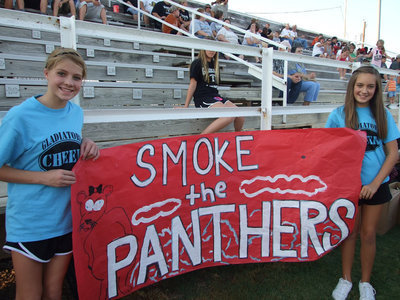 Image: Italy Jr. High cheerleaders Halee Turner and Jozie Perkins get ready for the game.