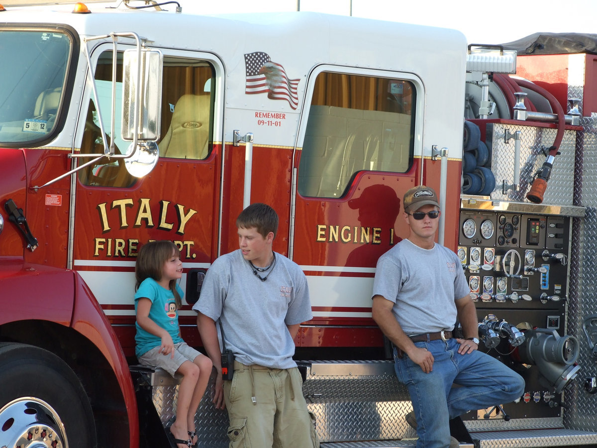 Image: Expecting a packed stadium, the Italy Volunteer Fire Department helped to park cars but kept their fire engines close in case they had to leave for an emergency.