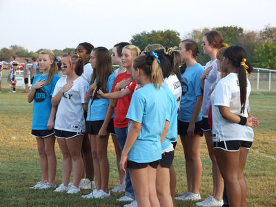 Image: Italy varsity, JV and junior high cheerleaders come together in song and honor the American flag during the pregame festivities.