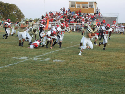 Image: Chase Hamilton(2) breaks away from a pack of Panthers for a gain of 34-yards.