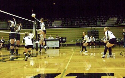 Image: Kaitlyn Rossa(3) shows her athleticism above the net.
