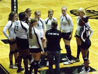 Image: Coach Richters talks with her team during a timeout.