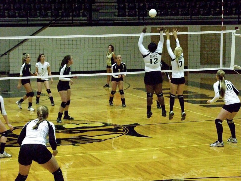 Image: Jimesha Reed(12) and Megan Richards(7) go for a double block of their own.