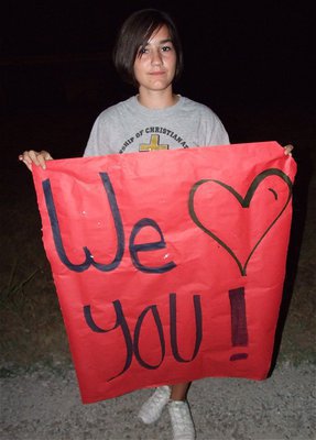 Image: Kaci Bales helps the community welcome Brandon home.