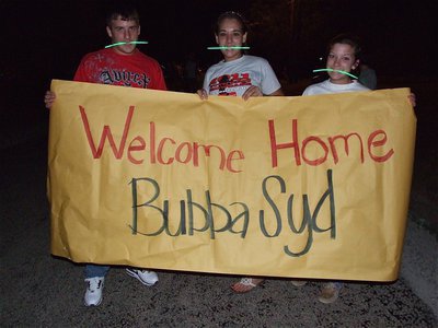 Image: Ethan Saxon, Alyssa Richards and Morgan Cocherham help light the way home for Brandon.