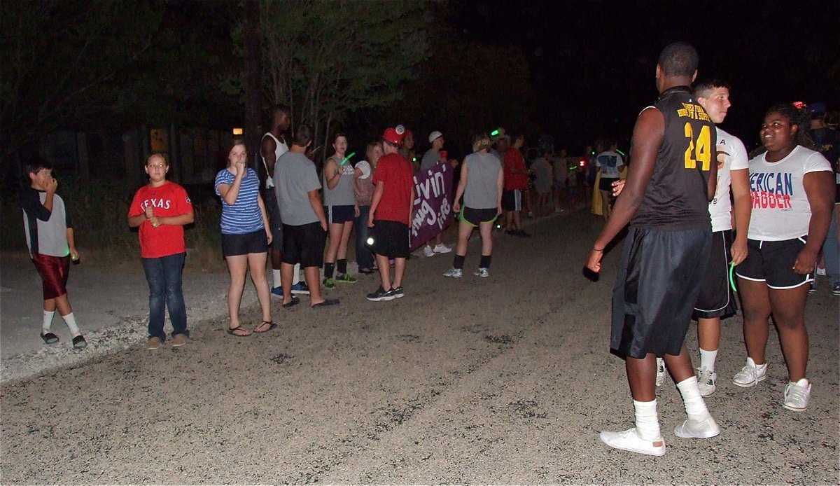 Image: The community lines the street to Brandon’s house to welcome him home.