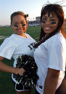 Image: IHS Cheerleaders Destani Anderson and Ashley Harper add a touch of style to the Panther’s stadium.