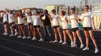 Image: The IHS cheerleaders sing the school song before the game. (L to R) Kelsey Neson, Bailey DeBorde, Ashley Harper, Kendra Copeland, Destani Anderson, mascot Sa’Kendra Norwood, Beverly Barnhart, Felicia Little, Meagan Hooker and Kaitlyn Rossa.