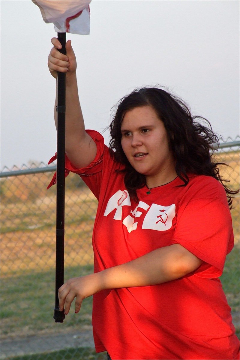 Image: Megan Buchanan practices the flags before taking the field with the band and flag corp.