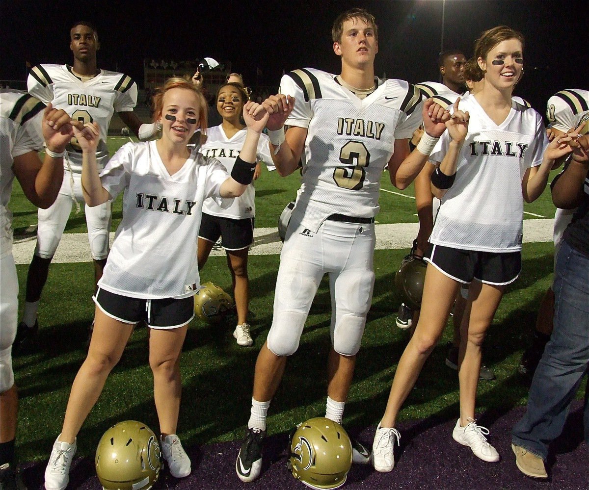 Image: Devonta Simmons(9), Felicia Little, Destani Anderson, Jase Holden(3) and Kaitlyn Rossa stand pinky-locked during the playing of Italy’s school song.