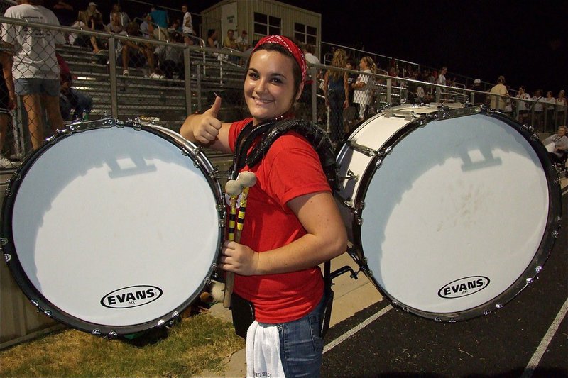 Image: Two base drums? No problem for IHS powerlifter and Gladiator Regiment Marching Band member Kaytlyn Bales.