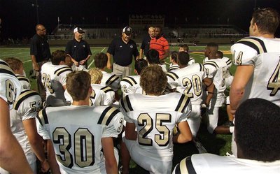 Image: Coach Craig Bales praises his team for a well played game against one of the top teams in the state.