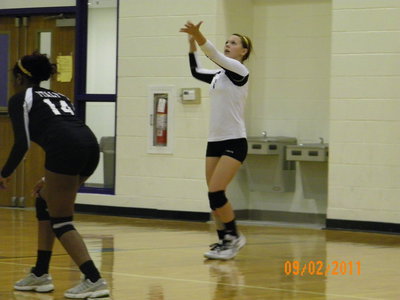 Image: Bailey Eubank puts over 1 of her 14 serves of the night.  