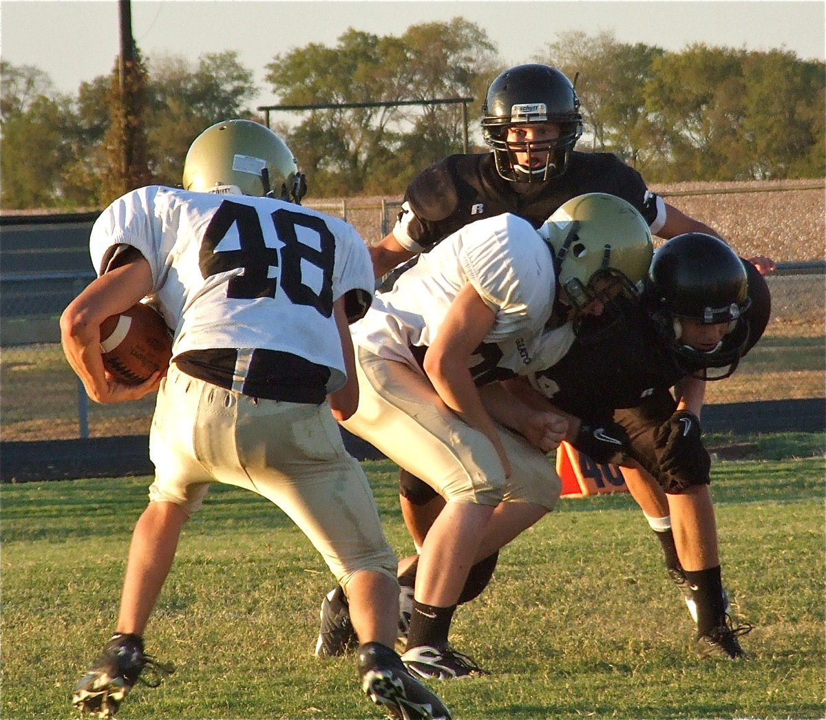 Image: Italy blocker John Escamilla(88) delivers a crushing block for Justin Wood(48).