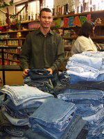 Image: Calyn Davis (Student Council President) helped pass out fliers telling everyone about the blue jean drive. He is shown here helping  sort the jeans by size.