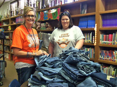 Image: Denise Wimbish and Bethany Bland (Technology Assistant) are busy sorting the jeans. Bethany said, “You should have seen the faces of the little kids when they saw all of the blue jeans. They were so happy.”