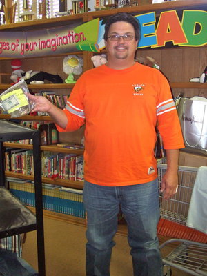 Image: Dwayne Betik (Technology Director) was amazed at all the donations. He is shown here with a cash donation.