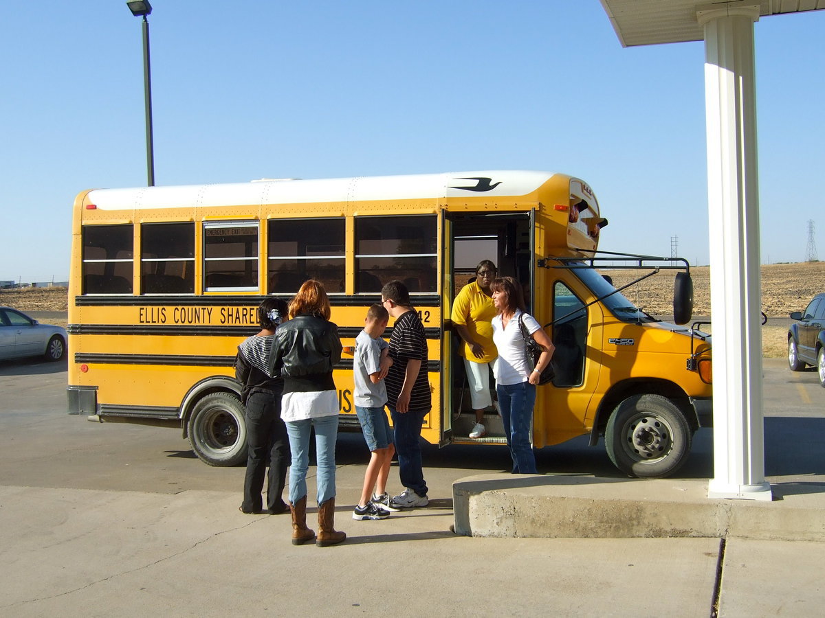 Image: Everyone off the bus to have some fun with the residents at Trinity Mission.