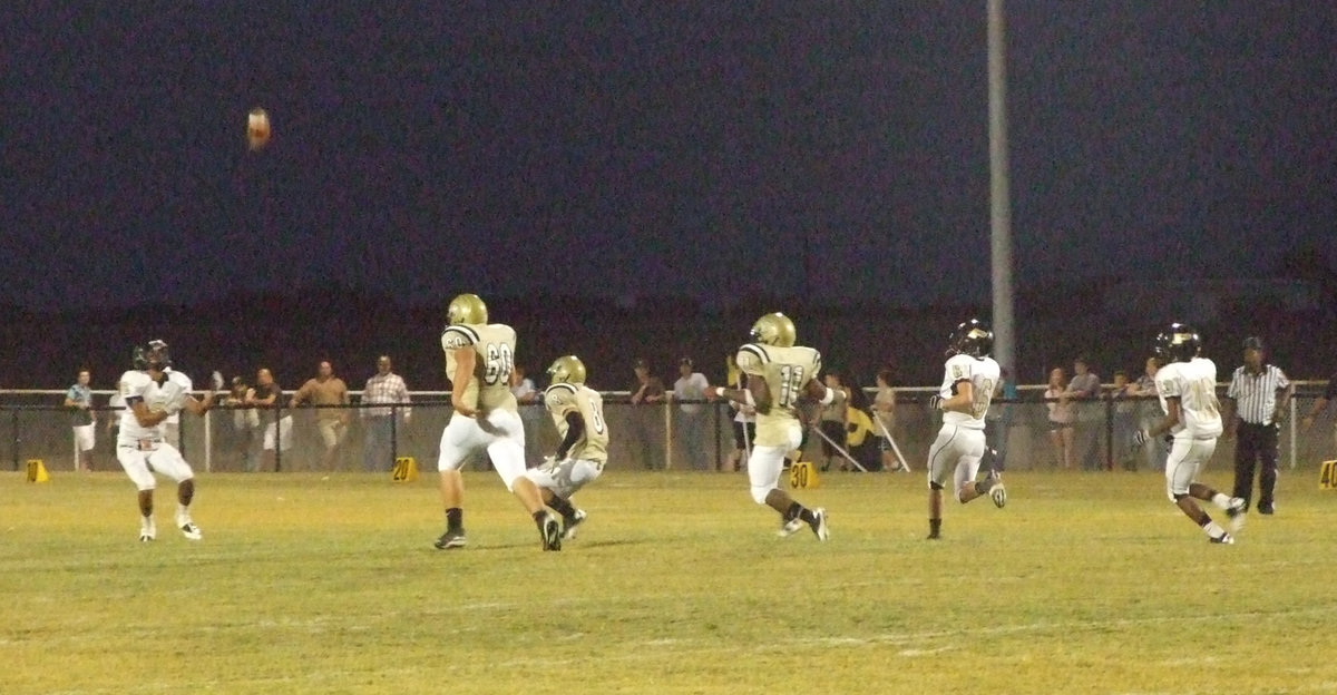 Image: Kevin Roldan(60), Hayden Woods(8) and Jalarnce Lewis(11) track down Palmer’s punt returner.