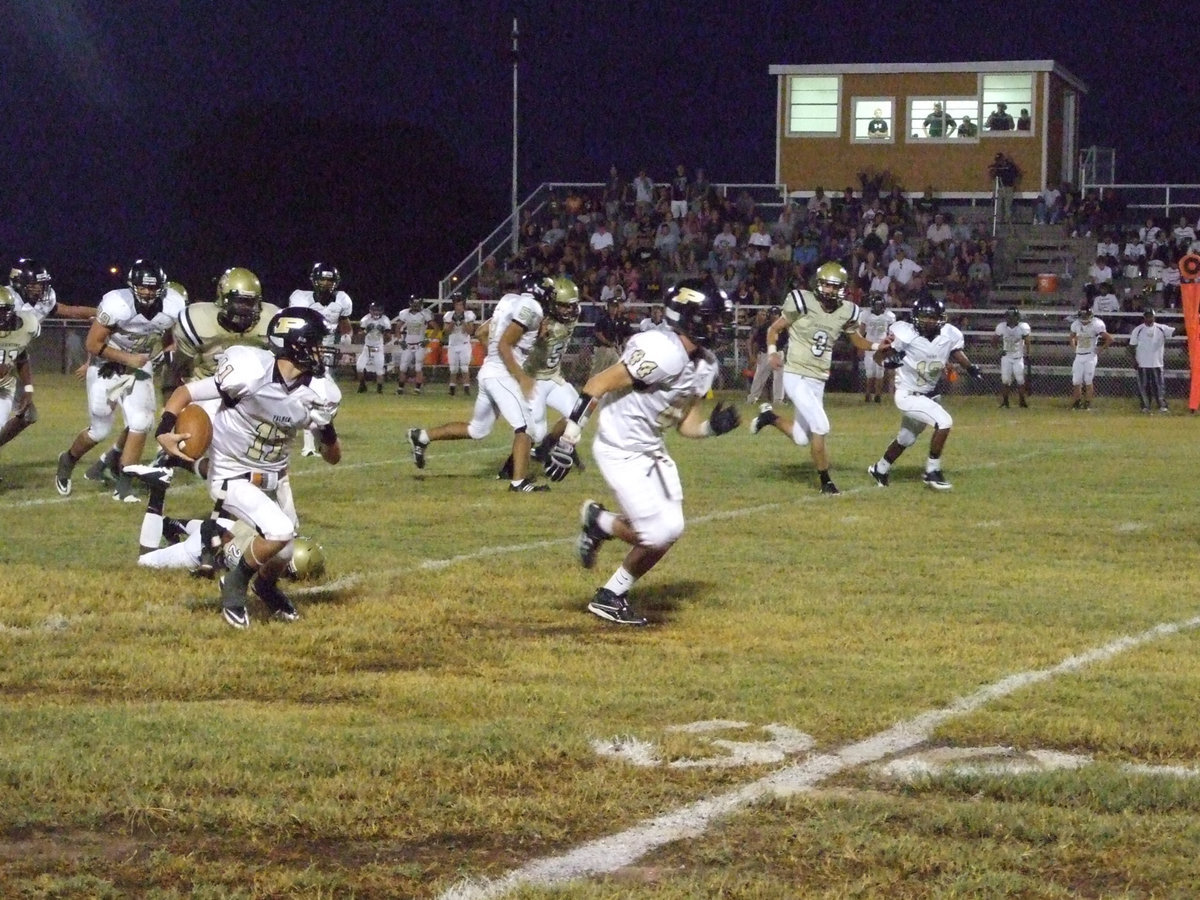 Image: Palmer’s Judge Wolfe(11) rambles for a 40-yard touchdown against Italy.