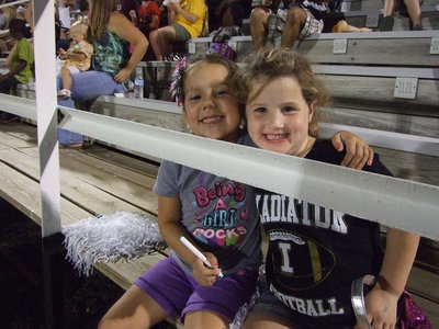 Image: Ella and Kinley are watching the cheerleaders for pointers.