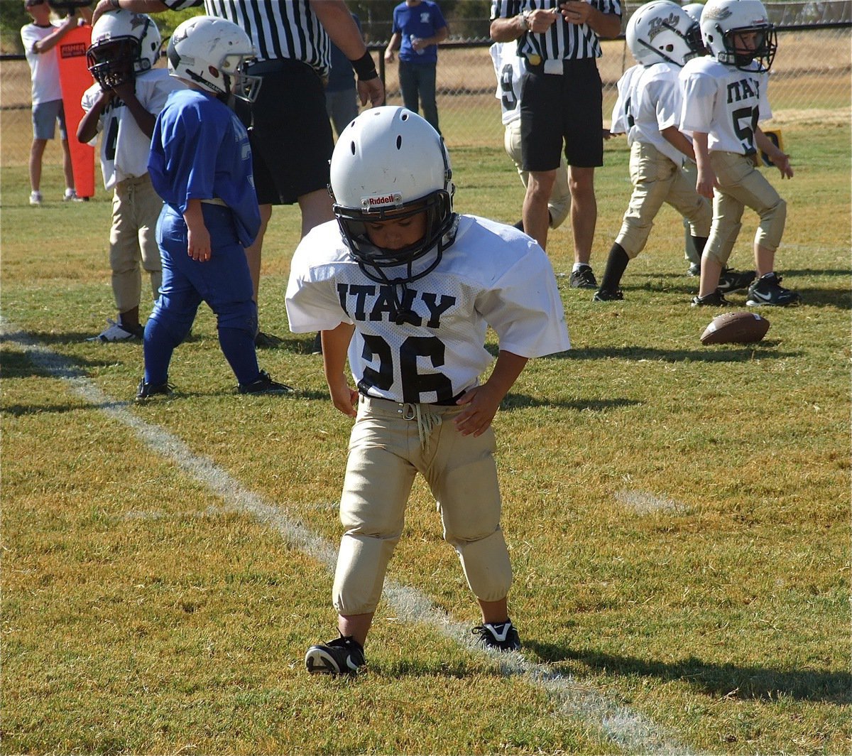 Image: Kanaan Richters(26) and his defensive teammates keep Rice from crossing the goal line in the fourth quarter to preserve a 12-0 shutout win for the IYAA C-Team.