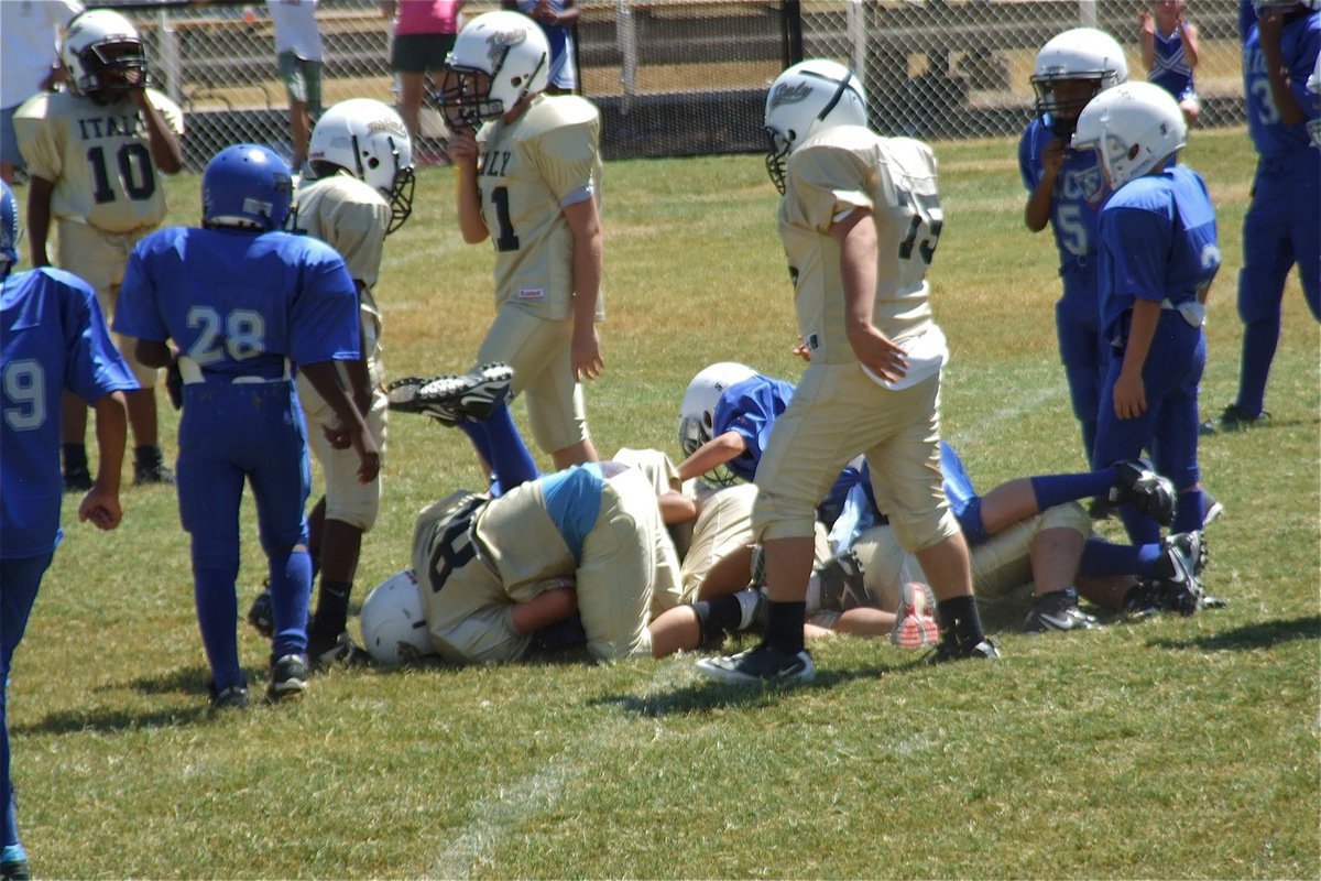 Image: Isaac Salcido(80) buries a Bulldog runner near midfield during the A-Team game.