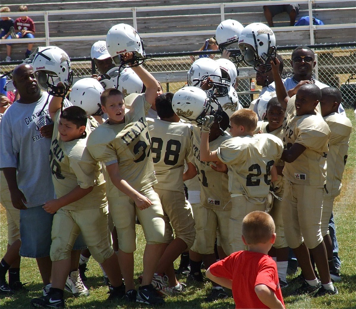 Image: The IYAA A-Team celebrates at midfield after their 26-0 win over Rice.