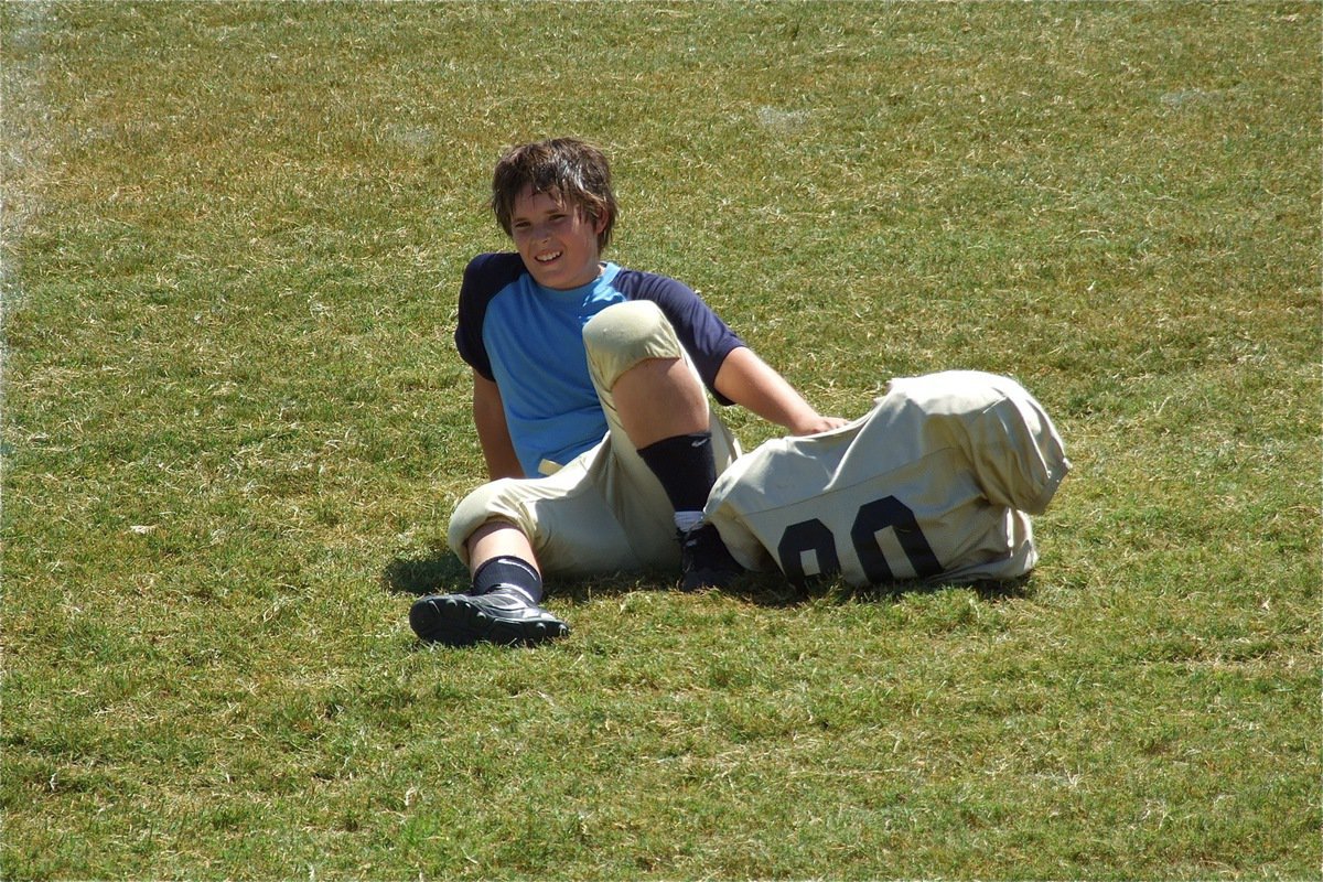 Image: Isaac Salcido takes a well deserved break after the game.