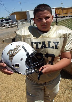 Image: Austin Lowe displays his new helmet and decal after the IYAA A-Team’s win over Rice.