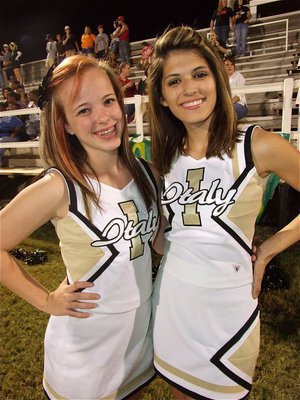 Image: Italy High School cheerleaders Felicia Little and Beverly Barnhart take time out of their busy schedule for a photo.