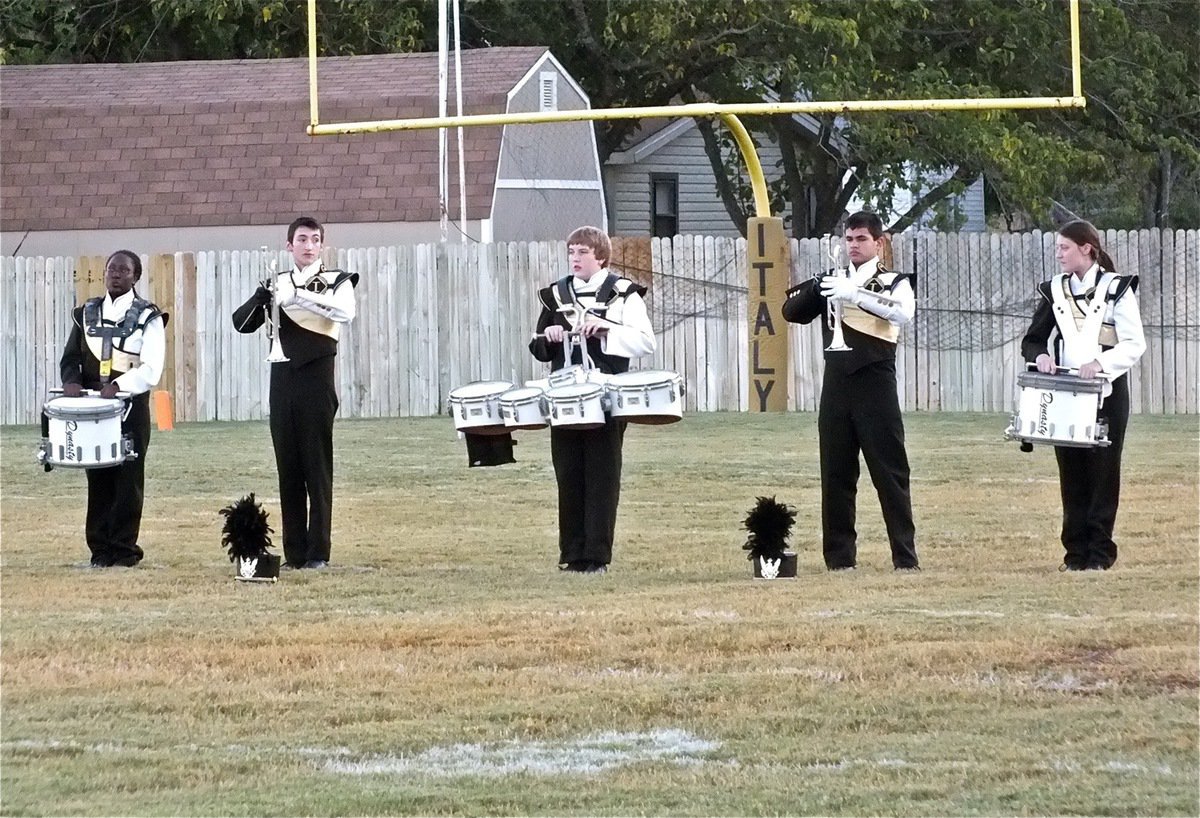 Image: Gladiator Regiment Marching Band members prepare to play the National Anthem.