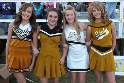 Image: Fond memories: Jozie Perkins, Sarah Coleman, Brittany Chambers and Halee Turner model old school cheerleading uniforms.
