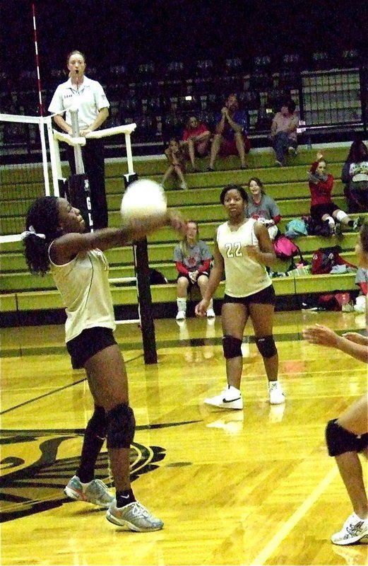 Image: Kendra Copeland bump the ball into the air.