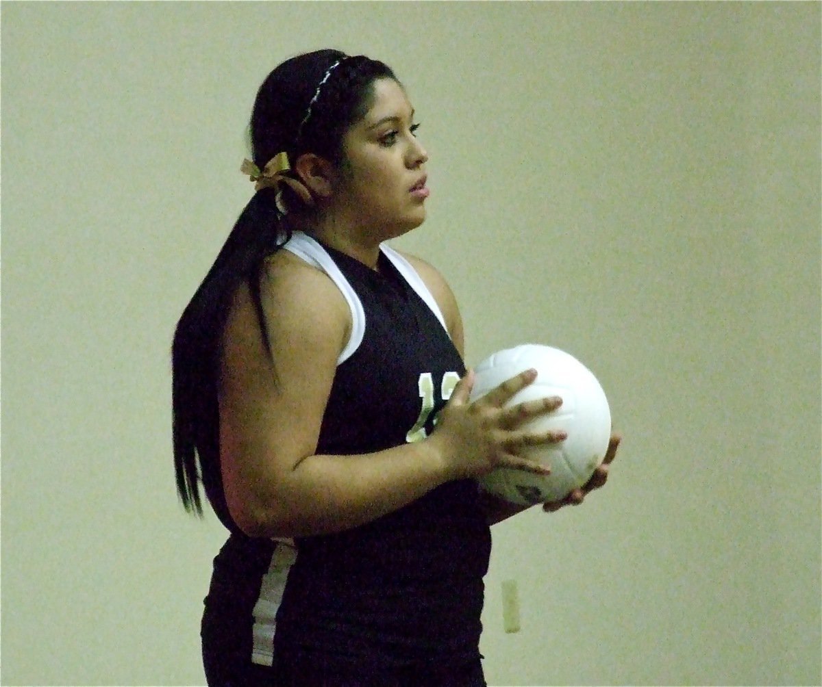 Image: Monserrat Figueroa is preparing to serve to start the second JV game against Maypearl.