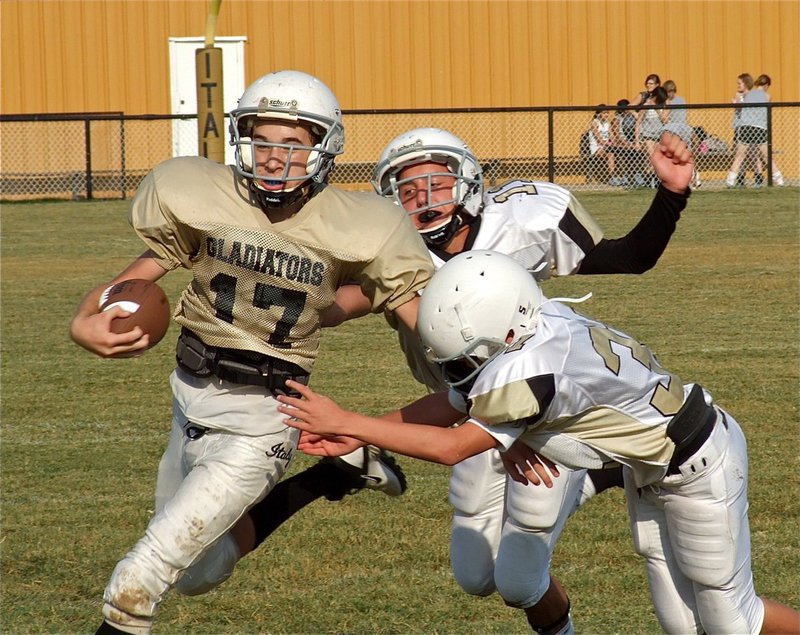Image: As quarterback for the Italy Jr. High Gladiators on Thursday, Ryan Connor(17) kept Italy moving the ball consistently and helped the offense put up two touchdowns. The Hubbard Jaguars were impressive, as well, and pulled away in the second half to win 28-14.   