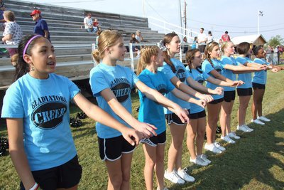 Image: Go, Italy, go! The Italy Jr. High/JV Cheerleaders urge their Gladiators forward before the kickoff. 