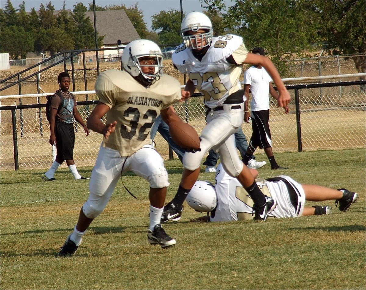 Image: Jaray Anderson(32) escapes a couple of Jaguars in his backfield takes off downfield.