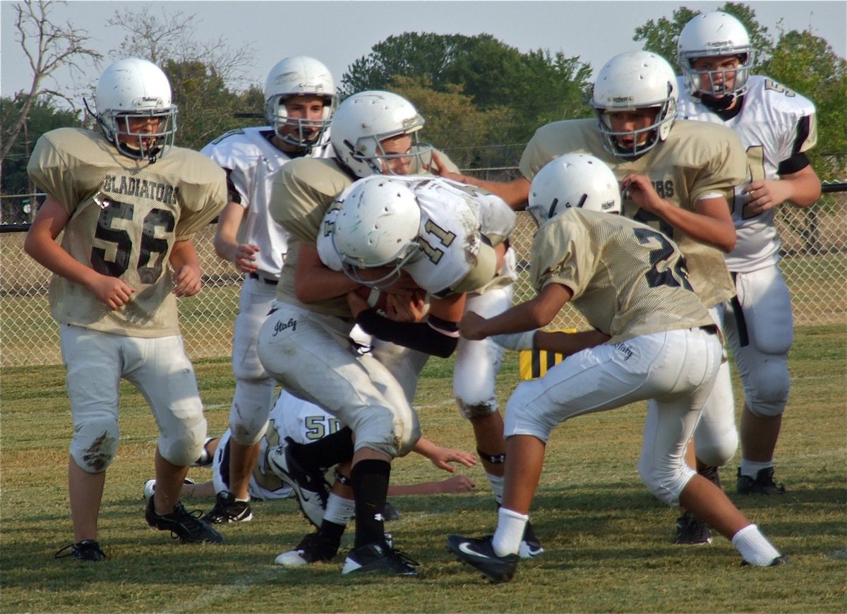 Image: Making the tackle are Elliot Worsham(56), Ryan Connor(17), Fabian Cortez(22) and Darren Cisneros(8).