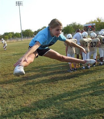 Image: Cheerleader Halee Turner tries to inspire the Jr. High Gladiators to reach another level.